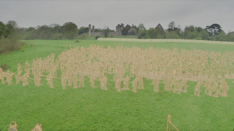 Un fermo immagine di uno dei documentare introduttivi: sulla ripresa reale del luogo dove andremo a combattere, vengono sovraimpressi i soldati in marcia. Suggestivo! Nel gioco sono presenti anche altri documentari extra, sulla falconeria per esempio, sui punti forti e deboli della balestra, su come si realizza una cotta di maglia