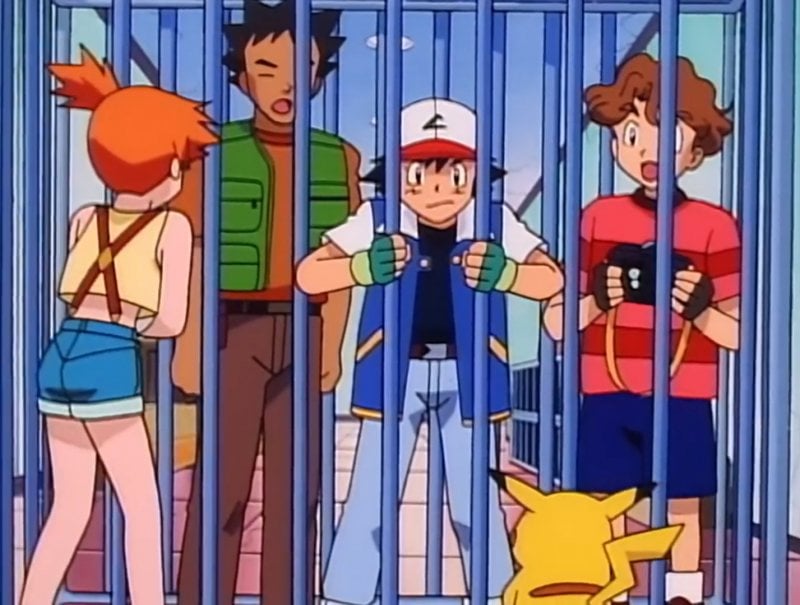 Ash y sus compañeros en prisión, de una escena de la serie animada Pokémon
