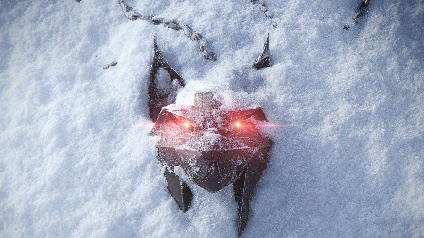 Il ciondolo del lupo di The Witcher immerso nella neve