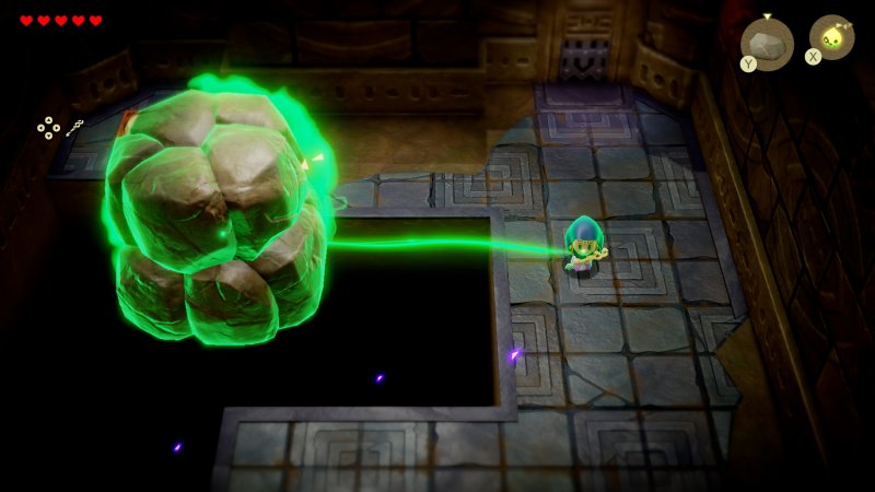 Zelda usa i suoi poteri magici per spostare un macigno Zelda usa i suoi poteri magici per spostare un macigno