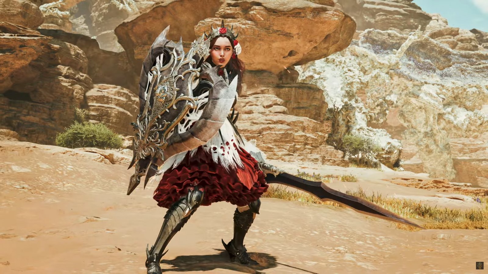 Una cacciatrice di Monster Hunter Wilds con Spadascia Caricata