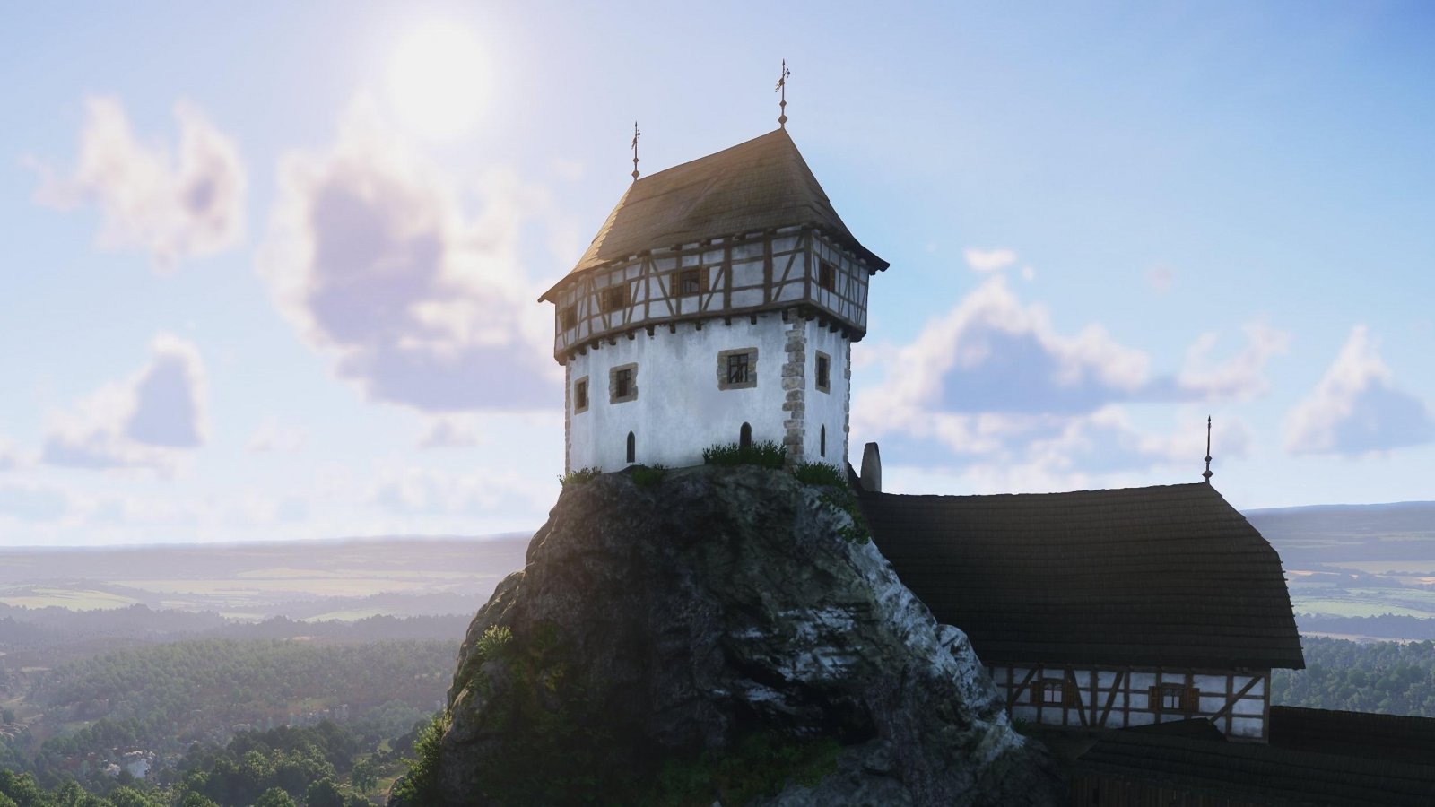 Un edificio in cima a una montagna in Kingdom Come: Deliverance 2
