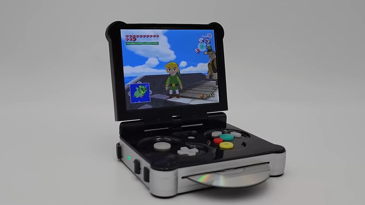 Una retro console falsa in stile game boy advence SP con un lettore disco