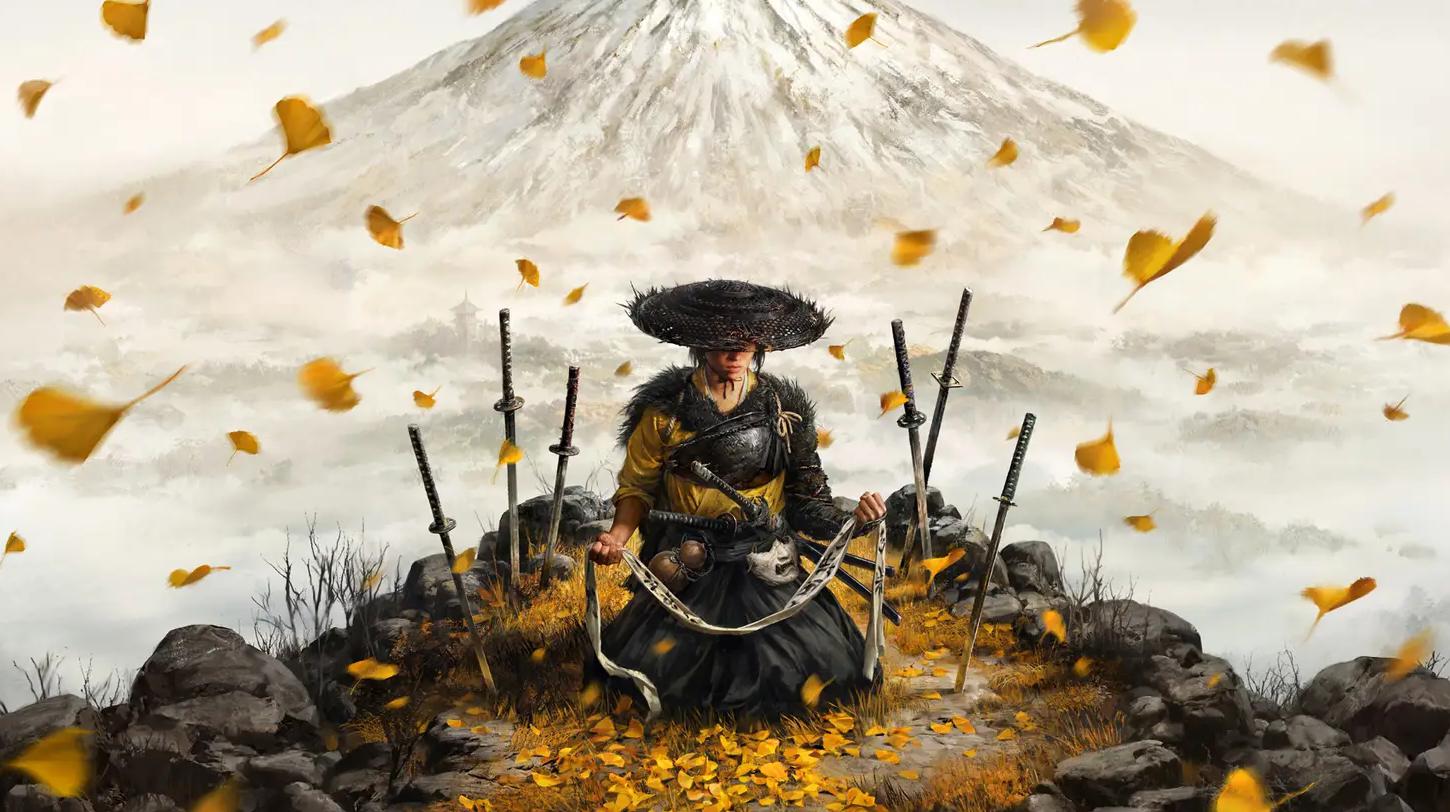 Atsu di Ghost of Yotei seduto su delle foglie in mezzo alle spade con il monte Yotei sullo sfondo