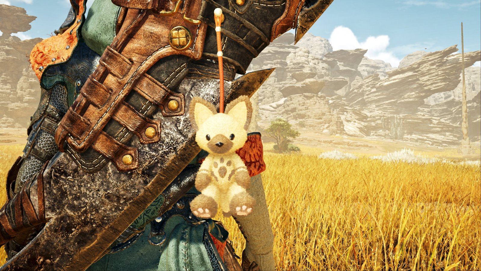 Un ciondolo a forma di gatto appeso a una spada in Monster Hunter Wilds