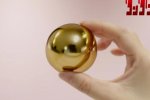 Fan di DanDaDan accorrete, perché ora potete acquistare le gonadi maschili d'oro perdute di Okarun - Notizia