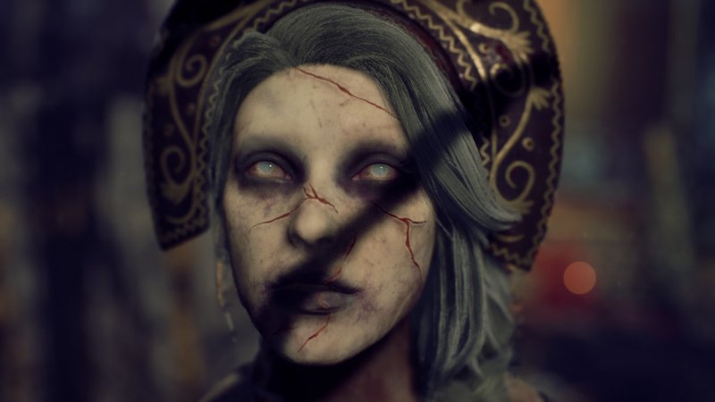 Una bambola di porcellana che ha preso vita? Un essere dotato di poteri sovrannaturali? Chi si nasconde dietro a questo viso? Non lo sapremo mai, perché è solo una delle tante inutili comparse di Ebola Village