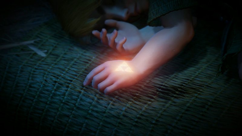 La mano di Link, sulla quale rifulge la Triforza