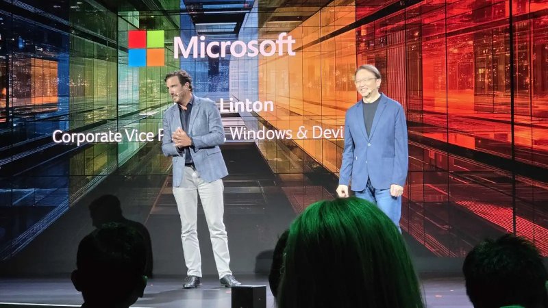 On the left is Mark Linton, corporate vice president of Windows and Device Sales
